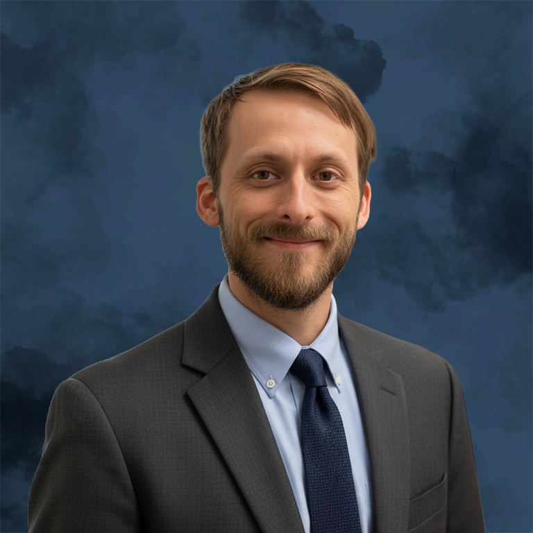 Nick Wetta cleaned up headshot blue